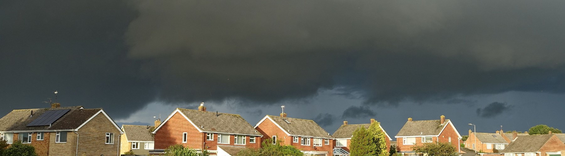 Landscape of houses with storm weather