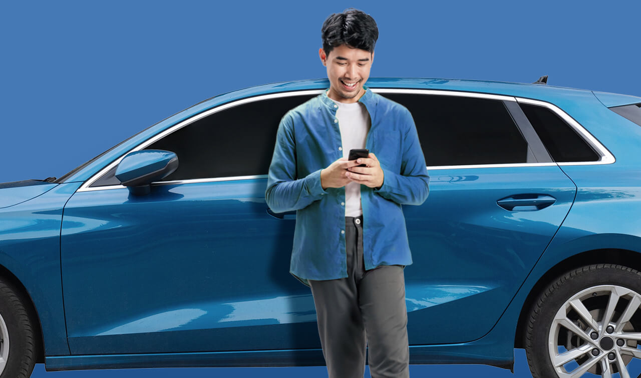 Man leans against blue car