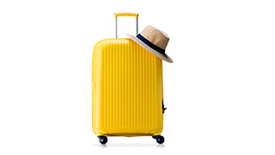Yellow suitcase and a hat