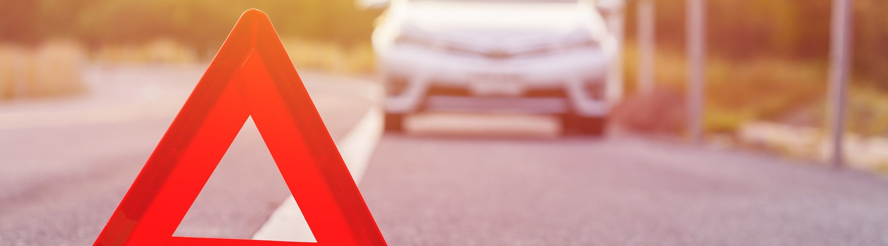 Silver car with triangle after breakdown