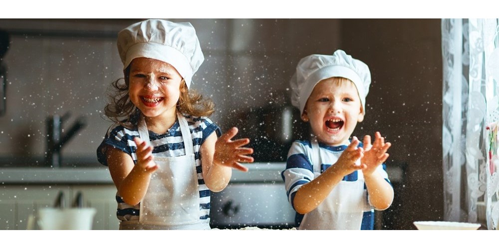 Happy kids having fun baking
