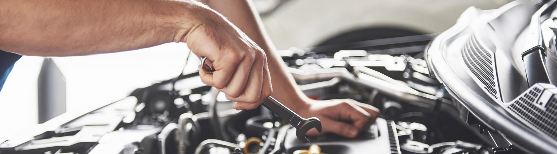 Man checking his car engine