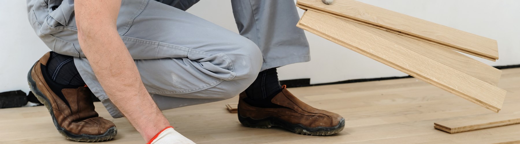 Man fixing floorboards