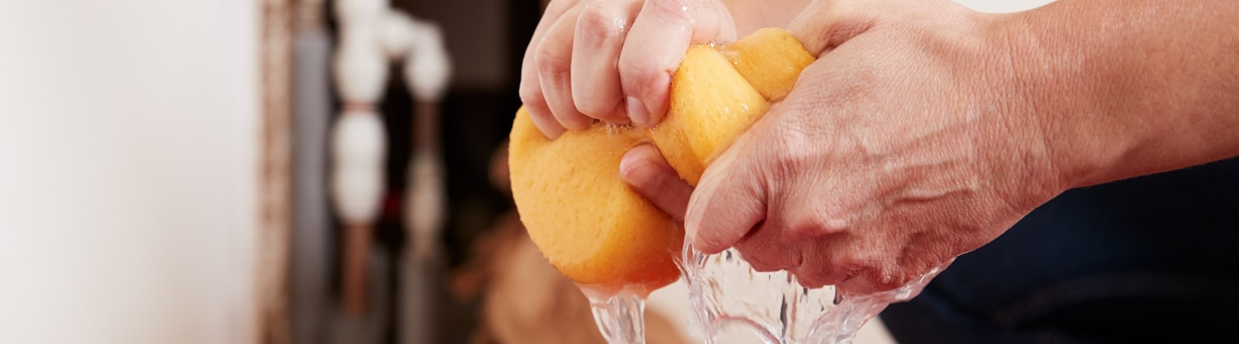 leaking water being cleared up with sponge