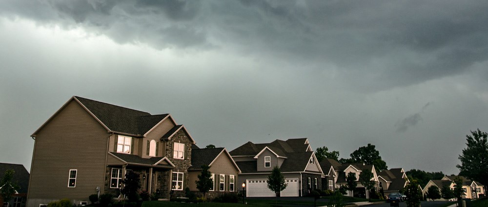 Homes with stormy skies
