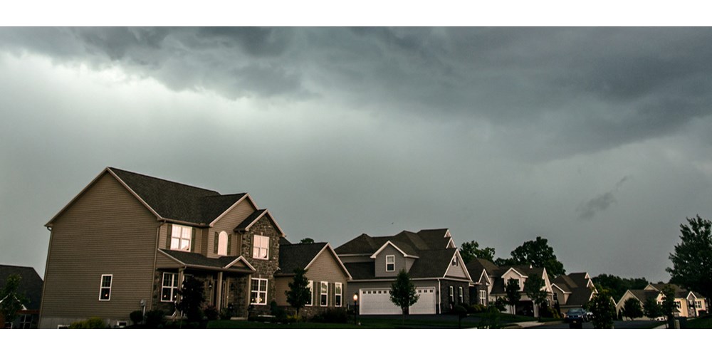 Homes with stormy skies