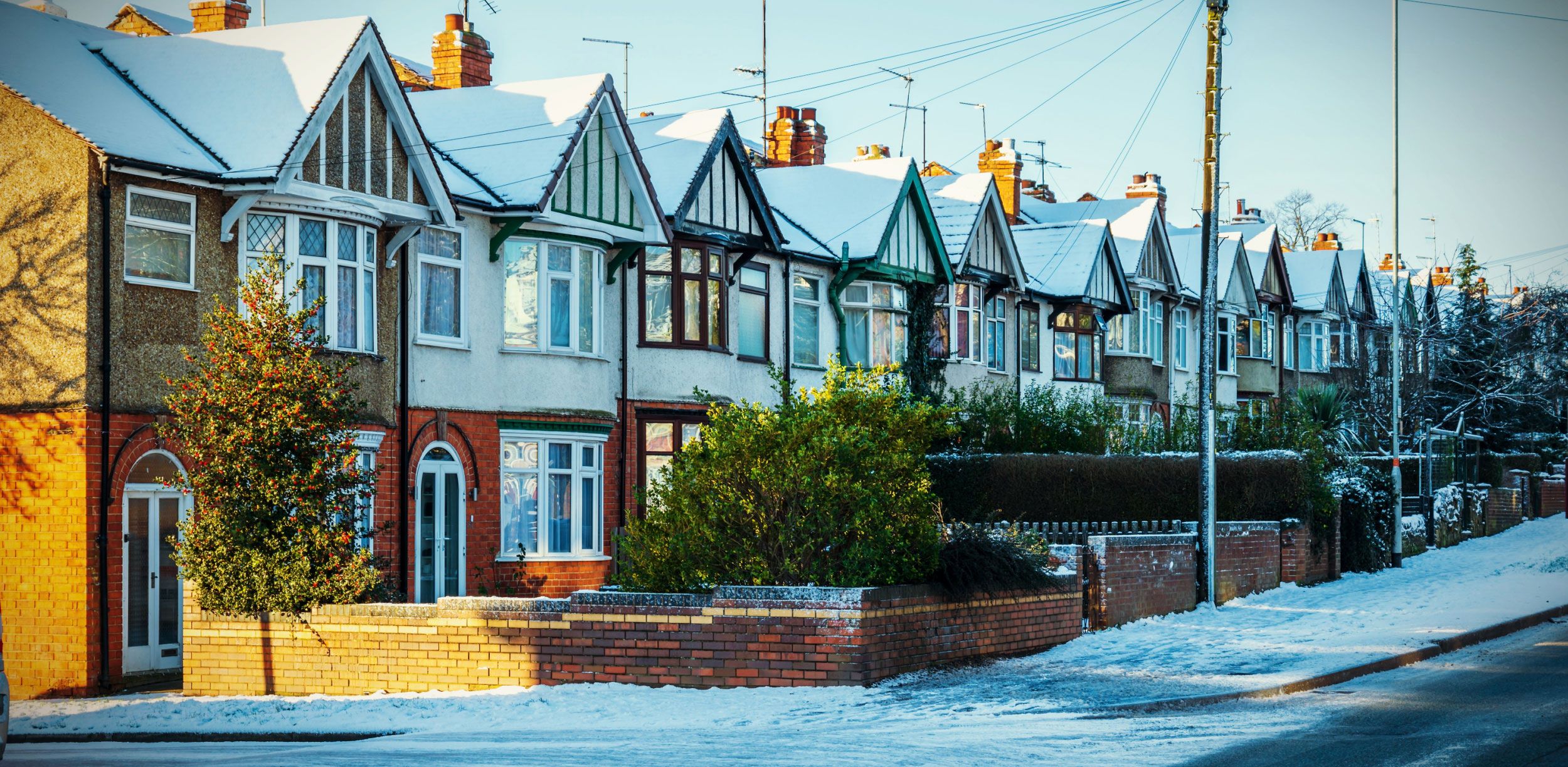 row of houses on snowy street