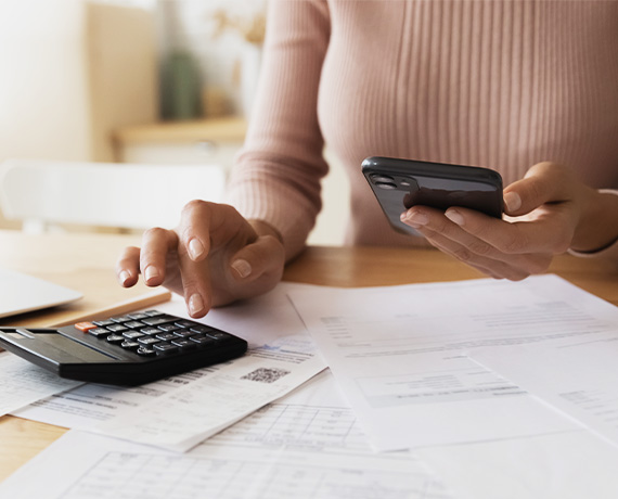women with a calcuator and papers